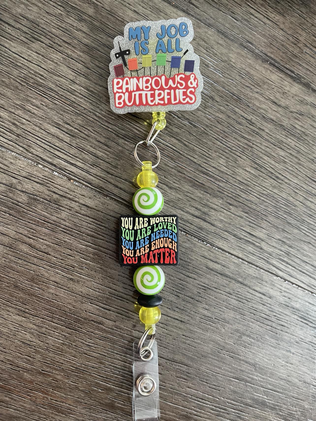 My job is all Rainbows & Butterflies Badge Reel