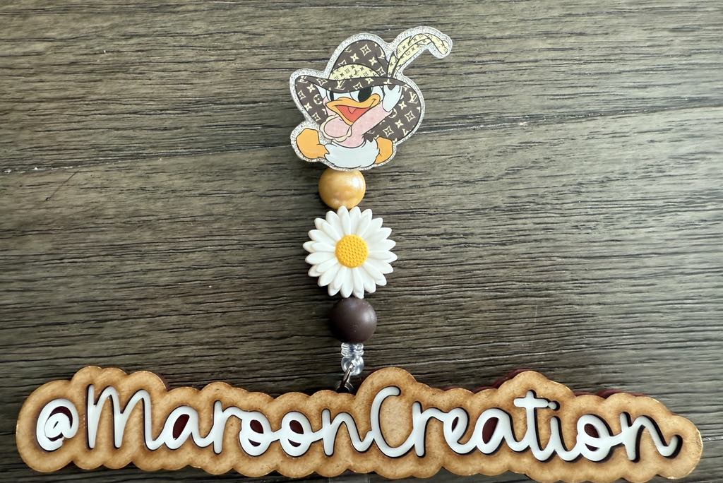 LV Daisy Duck Badge Reel